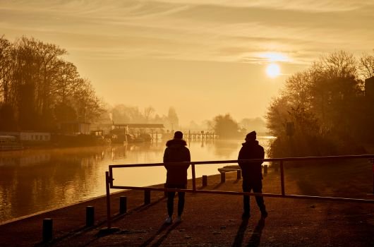 Two people admiring the sunrise at Molesey Lock, Molesey 
